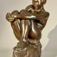 Alt text: Bronze sculpture of a pensive woman