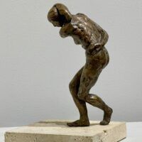 Alt text: Bronze sculpture of a dancing figure