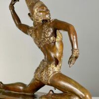 Alt text: Bronze sculpture of a female dancer, detail