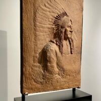 Alt text: Terracotta relief of Chief Sitting Bull