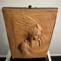 Alt text: Terracotta relief of Chief Sitting Bull