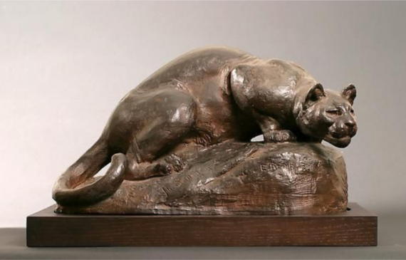 Alt text: Bronze sculpture of a panther
