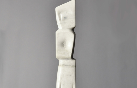 Alt text: Carved white marble totem