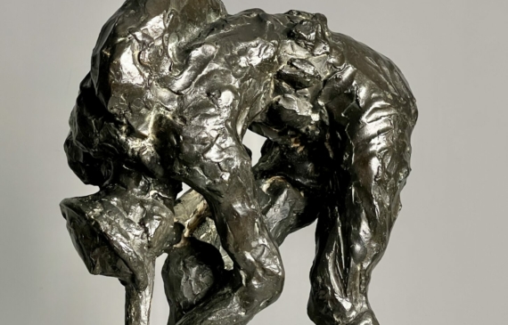 Alt text: Bronze sculpture of a bending man