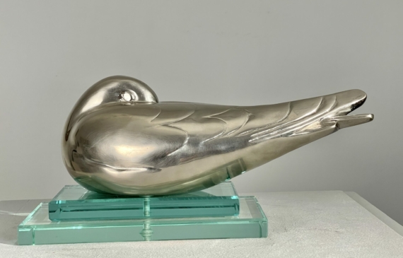 Alt text: metal sculpture of a sleeping bird
