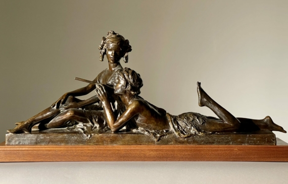 Alt text: Bronze sculpture of two people