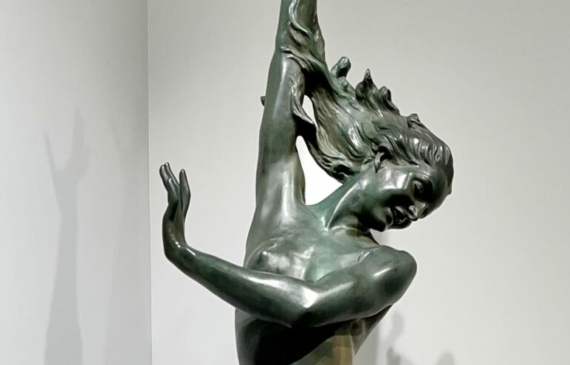 Alt text: bronze sculpture of a woman standing