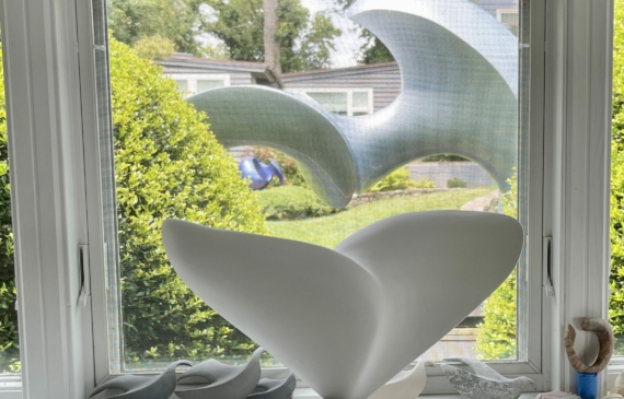 Alt text: photo of an unfinished sculpture in a window