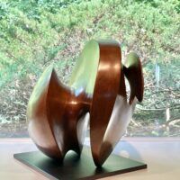 Alt text: bronze, oval shaped sculpture