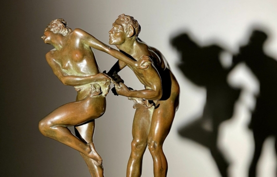 Alt text: bronze sculpture of two people