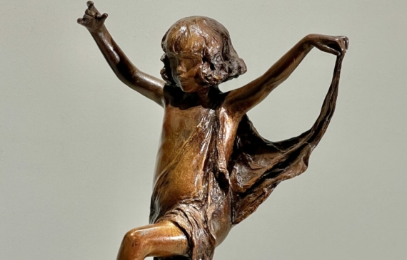 Alt text: Bronze sculpture of a young girl