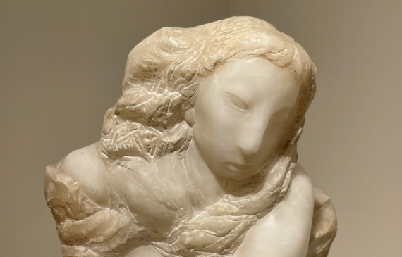 Alt text: Hand carved alabaster bust of an angelic-looking woman