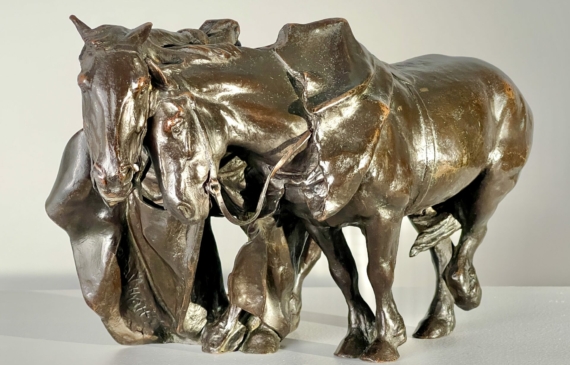 Alt text: Bronze sculpture of two horses
