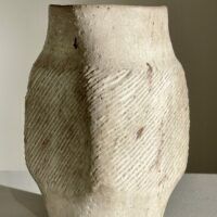 Alt text: White ceramic vase