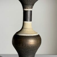Alt text: Brown ceramic vase