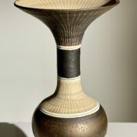 Alt text: Brown ceramic vase