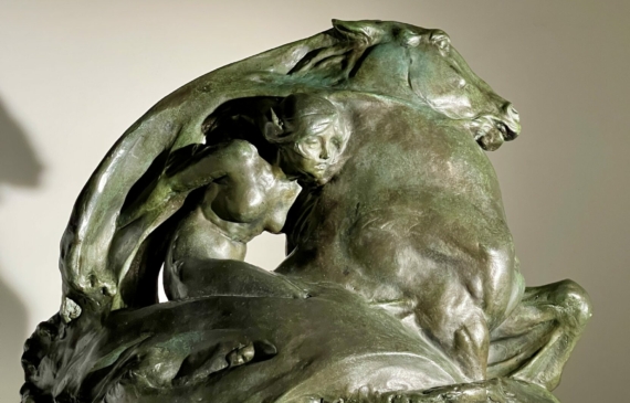 Alt text: Bronze sculpture of a woman on a horse