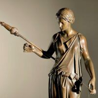 Alt text: Bronze sculpture of a standing woman