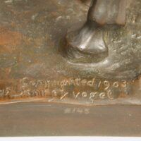 Alt text: Bronze sculpture, signature detail